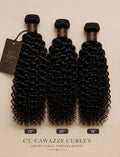 Three bundles of black curly hair extensions displayed side by side on a beige background, with brand tags and length labels showing 22 inches, 20 inches, and 18 inches. The brand name 'C'C Cawazze Curl's' is visible at the bottom.